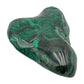 Side view of the malachite specimen turned to show the twist in its lobed silhouette.