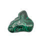 Dramatic angled view of the malachite specimen, with its tallest peak and a dark recessed pocket both visible.