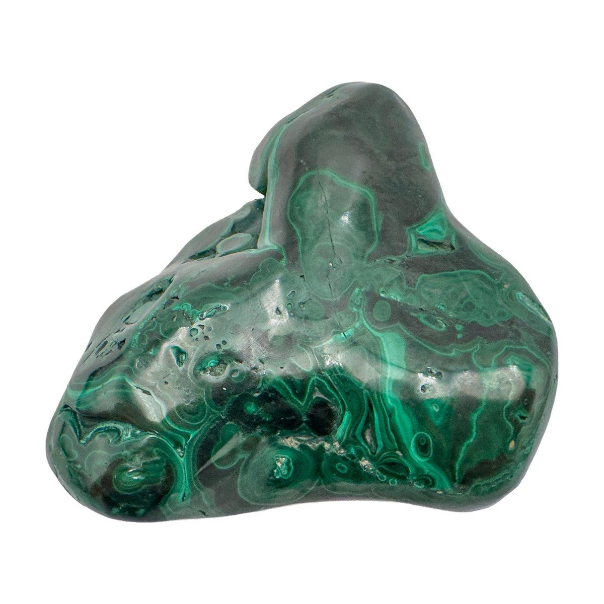 Dramatic angled view of the malachite specimen, with its tallest peak and a dark recessed pocket both visible.