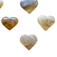 Edge view of Natural Citrine polished heart, turned to for Abundance and Manifestation.