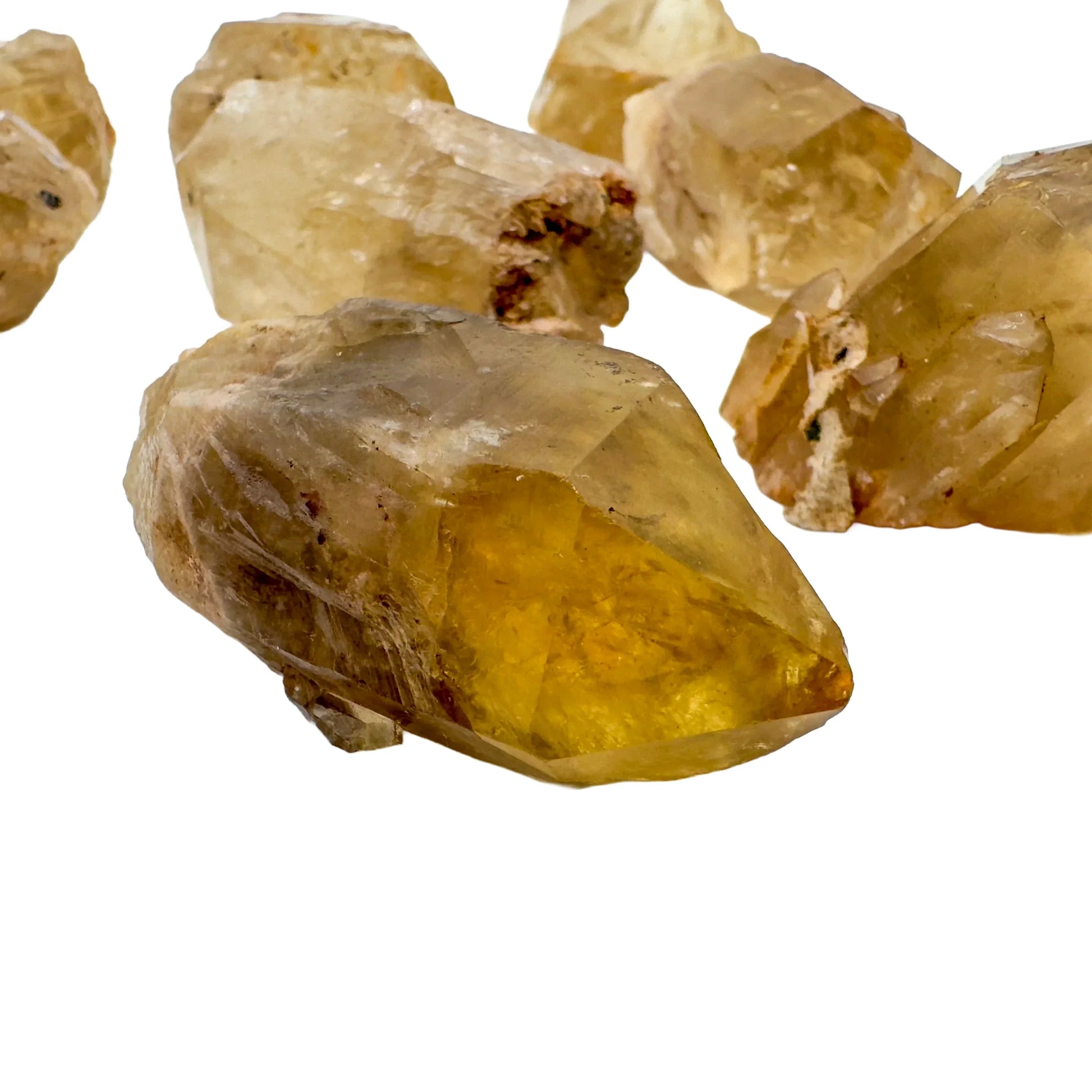 Profile view of Natural Citrine raw stone, hand-selected from Haut-Lomami, Democratic Republic of the Congo, showing subtle.