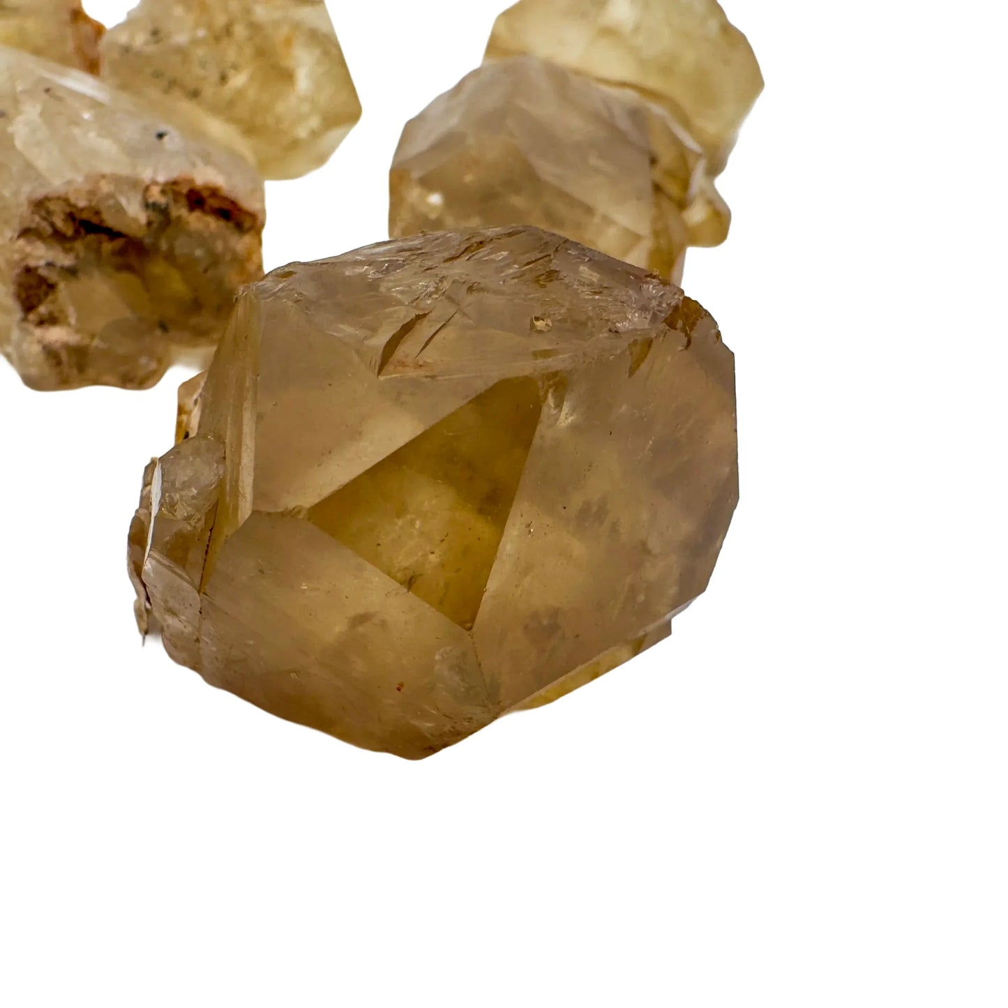 Top-down shot of Natural Citrine raw stone, sourced from Democratic Republic of the Congo.