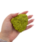 Nontronite no. 13 cupped in a hand, giving a sense of the 1.02 inch height and 70 gram weight.
