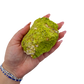 Scale reference for nontronite no. 22: the 3.76 by 2.74 inch specimen resting in an open hand.