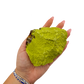 Nontronite no. 23 cupped in a hand, giving a sense of the 2.74 inch height and 338 gram weight.