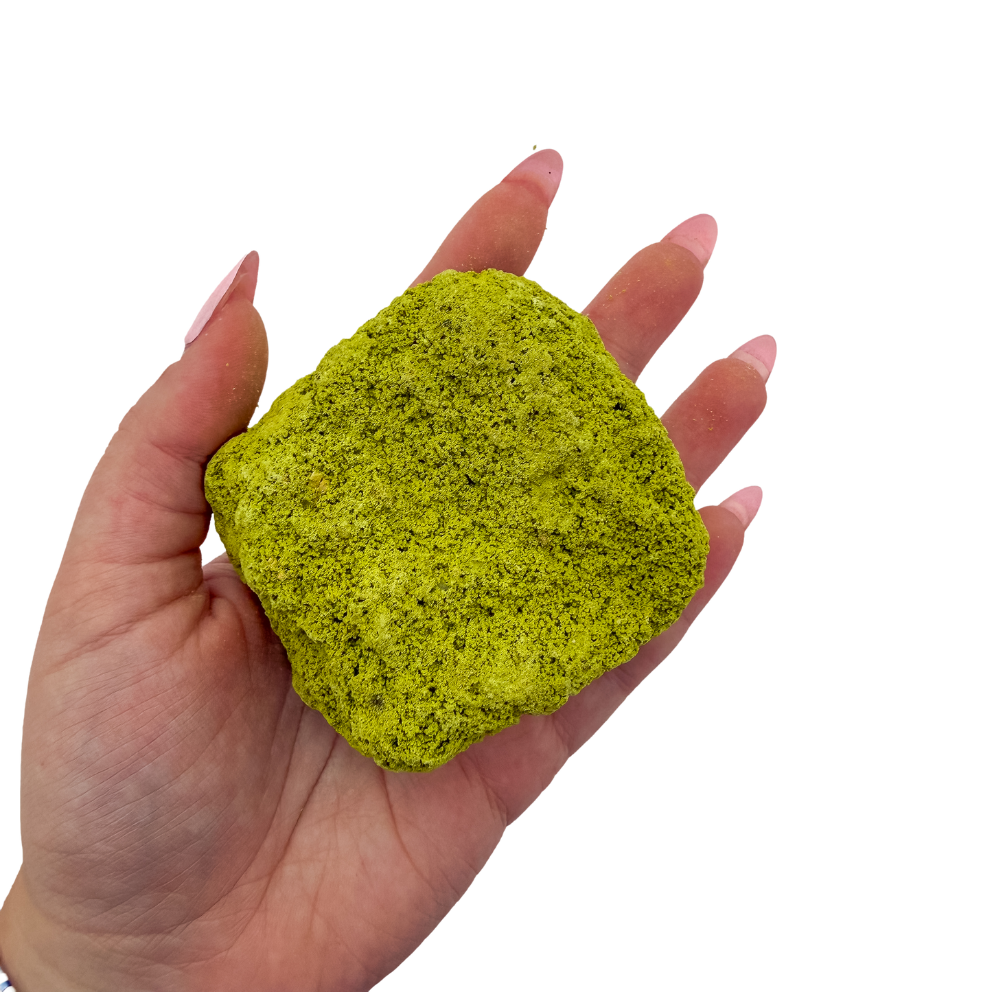 A hand holds nontronite no. 26 for scale, the 114 gram specimen spanning roughly 2.84 inches across the palm.