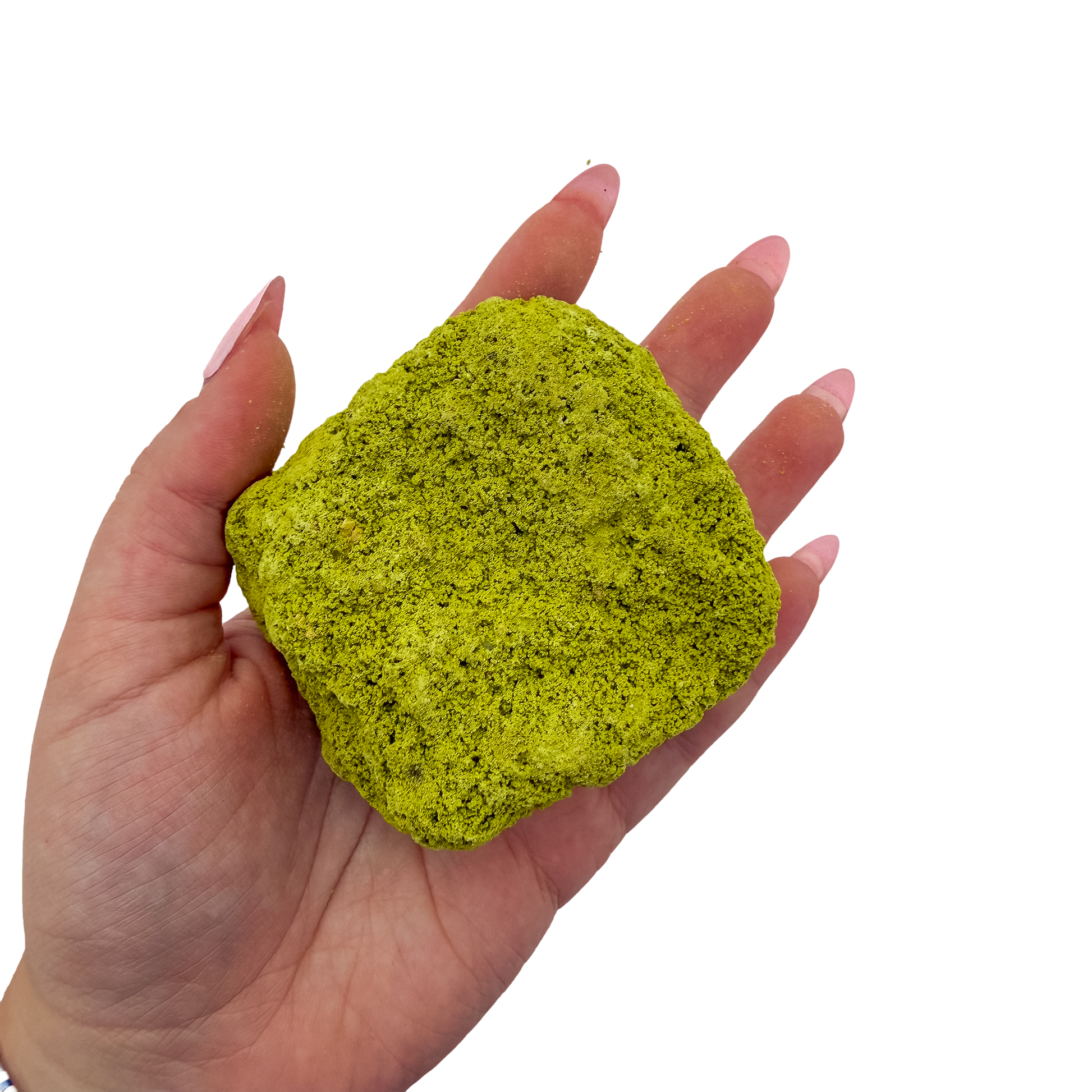 A hand holds nontronite no. 26 for scale, the 114 gram specimen spanning roughly 2.84 inches across the palm.