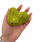 Scale reference for nontronite no. 27: the 2.88 by 2.63 inch specimen resting in an open hand.