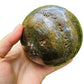 Sideways view of Grade AA Ocean Jasper polished sphere, often paired with practices around Emotional Healing, from Madagascar.