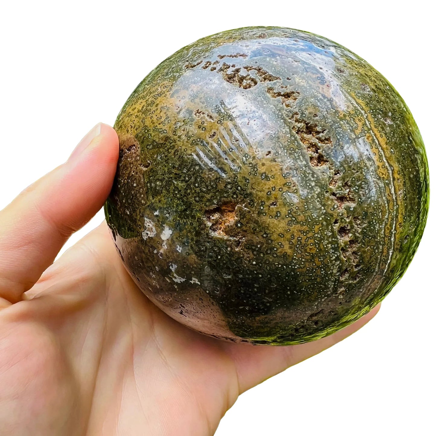 Sideways view of Grade AA Ocean Jasper polished sphere, often paired with practices around Emotional Healing, from Madagascar.