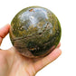 Top angle of Ocean Jasper polished sphere, sourced from Sofia, Madagascar, drawn on for Emotional Healing and Stress Relief.