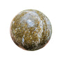 Lifestyle view of one Ocean Jasper polished sphere for scale, hand-selected from Sofia, Madagascar.