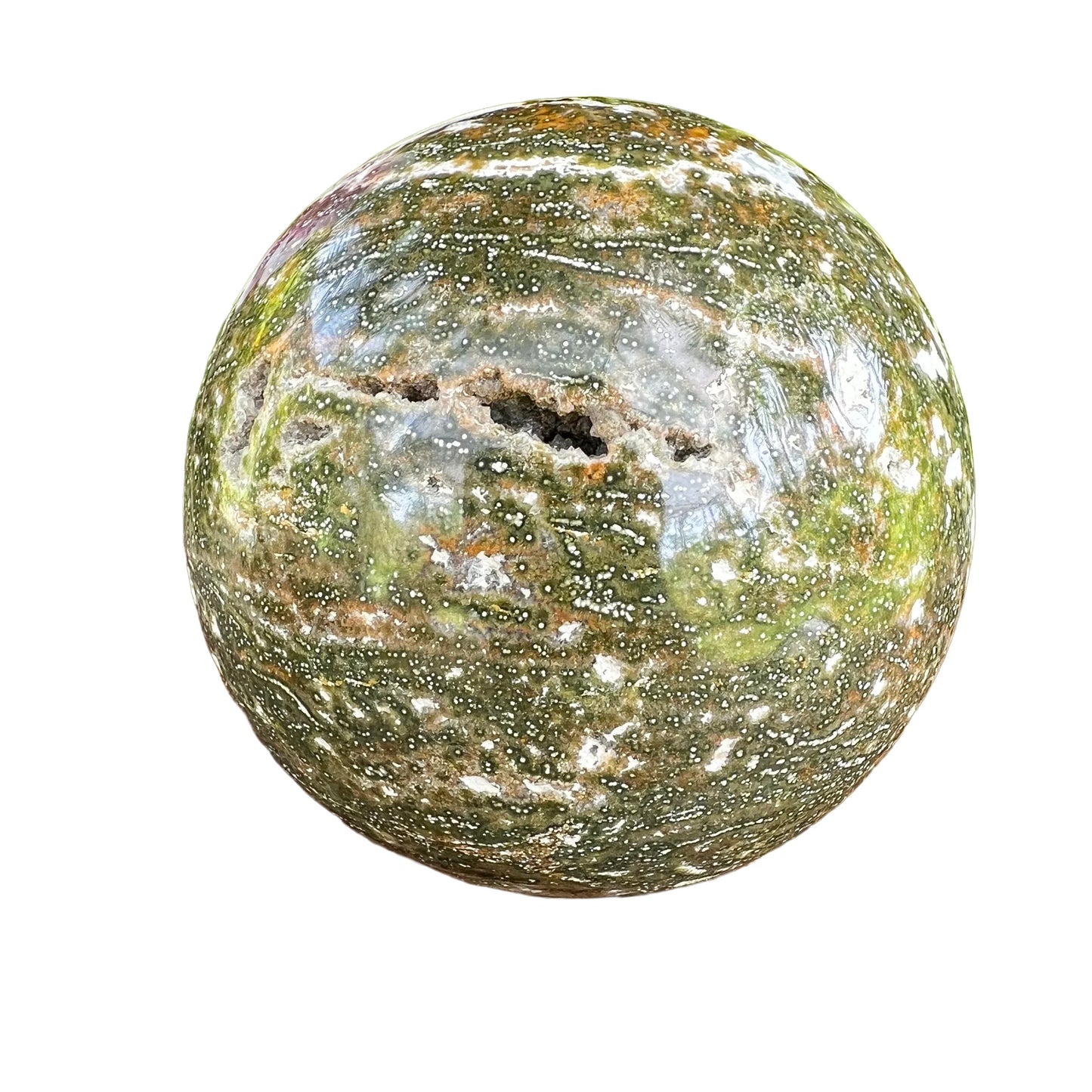 Side-on view of Ocean Jasper polished sphere, from Madagascar, turned to for Emotional Healing.