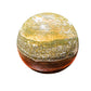 Color detail of green Ocean Jasper polished sphere, showing natural inclusions, drawn on for Emotional Healing and Stress Relief.