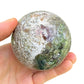 Detail shot of Grade AA Ocean Jasper sphere under natural light