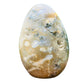 Top angle of green Ocean Jasper freeform, showing earthy tone, Madagascar-sourced.