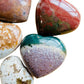 Looking down on Ocean Jasper polished heart, worked with for Emotional Healing and Stress Relief, sourced from Madagascar.