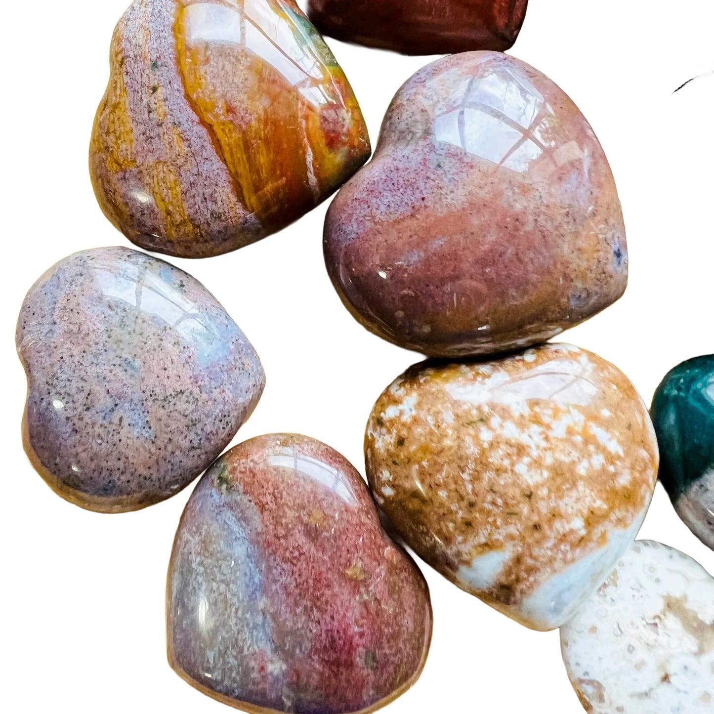 Reverse angle of Ocean Jasper polished heart, sourced from Sofia, Madagascar, showing earthy tone.