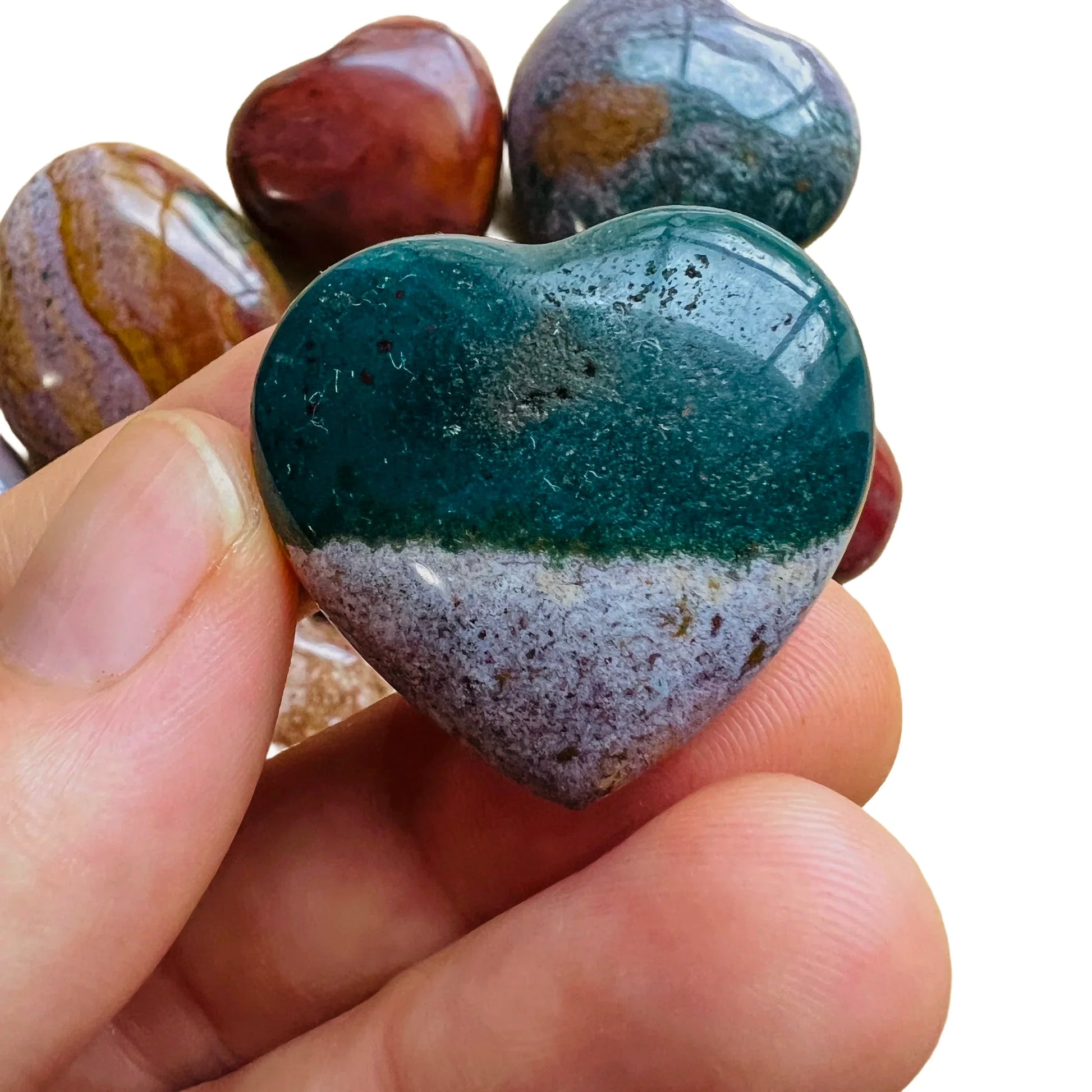 Detail shot of Grade AA Ocean Jasper heart under natural light