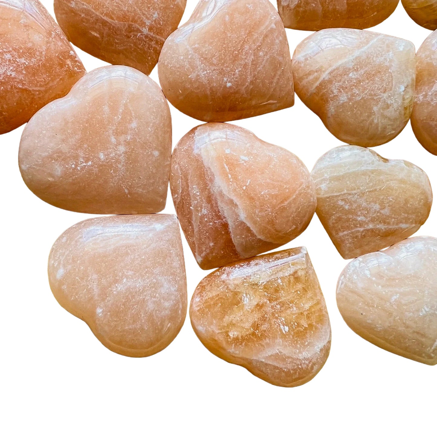Detail shot showing Grade AA Orange Calcite polished heart, showing natural inclusions.