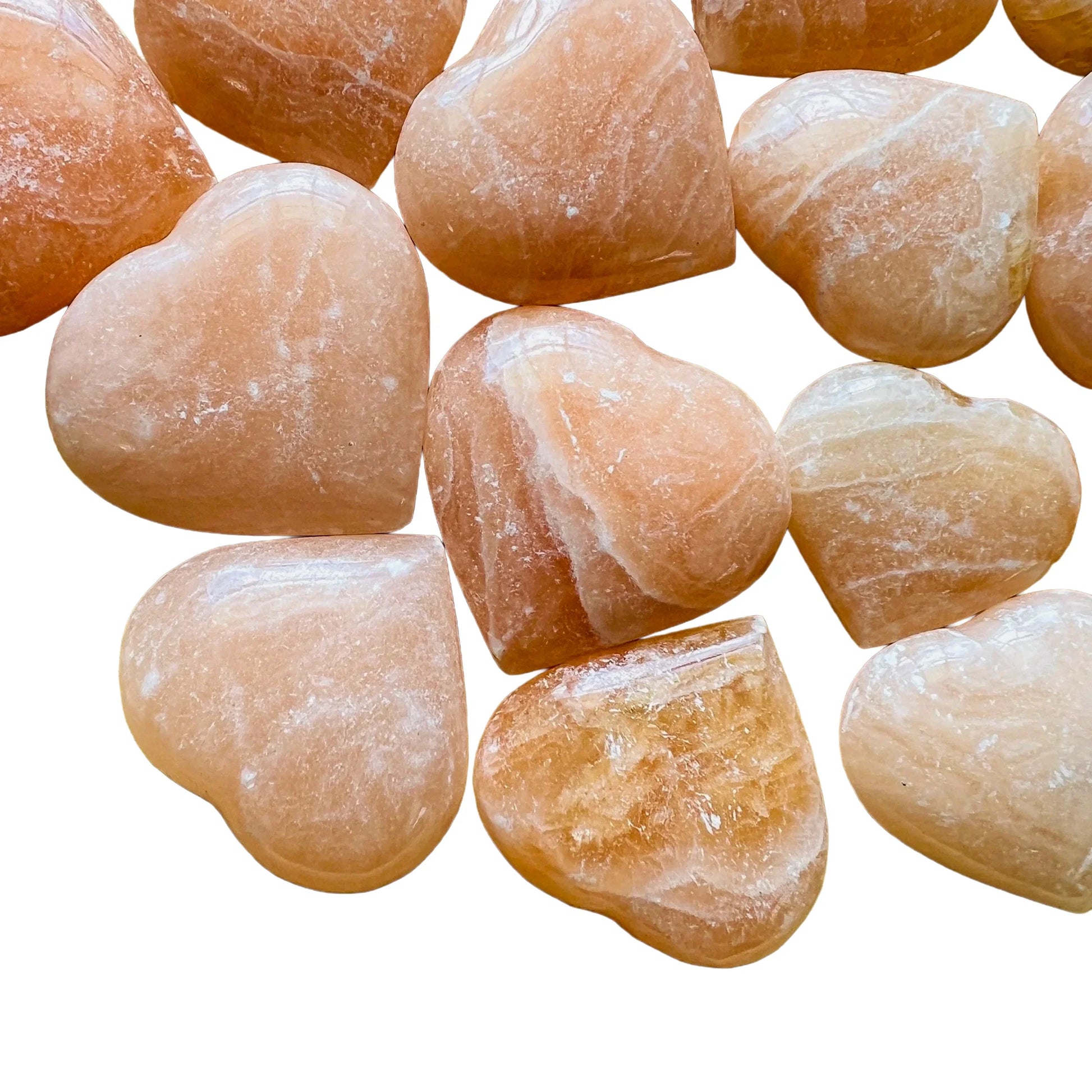 Detail shot showing Grade AA Orange Calcite polished heart, showing natural inclusions.