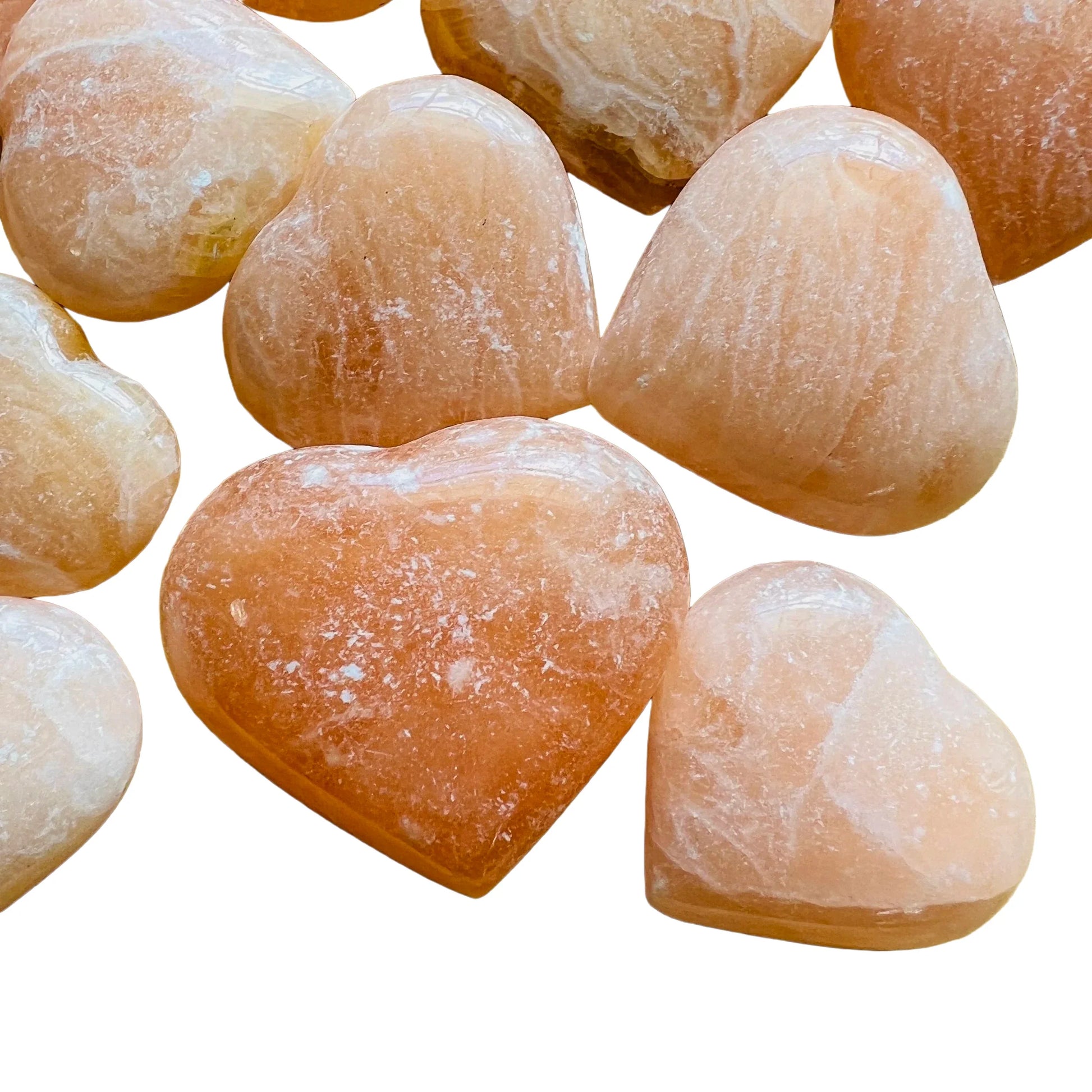 Side profile of Orange Calcite polished heart, from Madagascar.