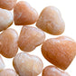 Bird's-eye view of Orange Calcite polished heart, showing earthy tone, sourced from Mahajanga, Madagascar.