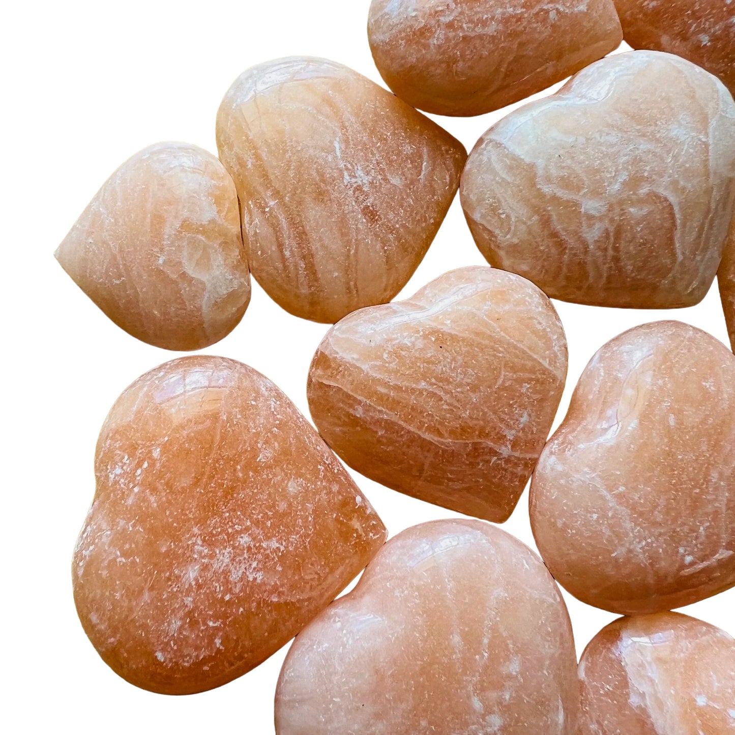 Underside detail of Orange Calcite polished heart, sourced from Mahajanga, Madagascar.