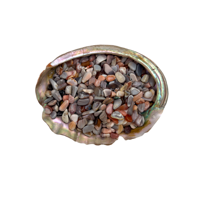 Grade A pink agate crystal chips in a bowl, sourced from Botswana
