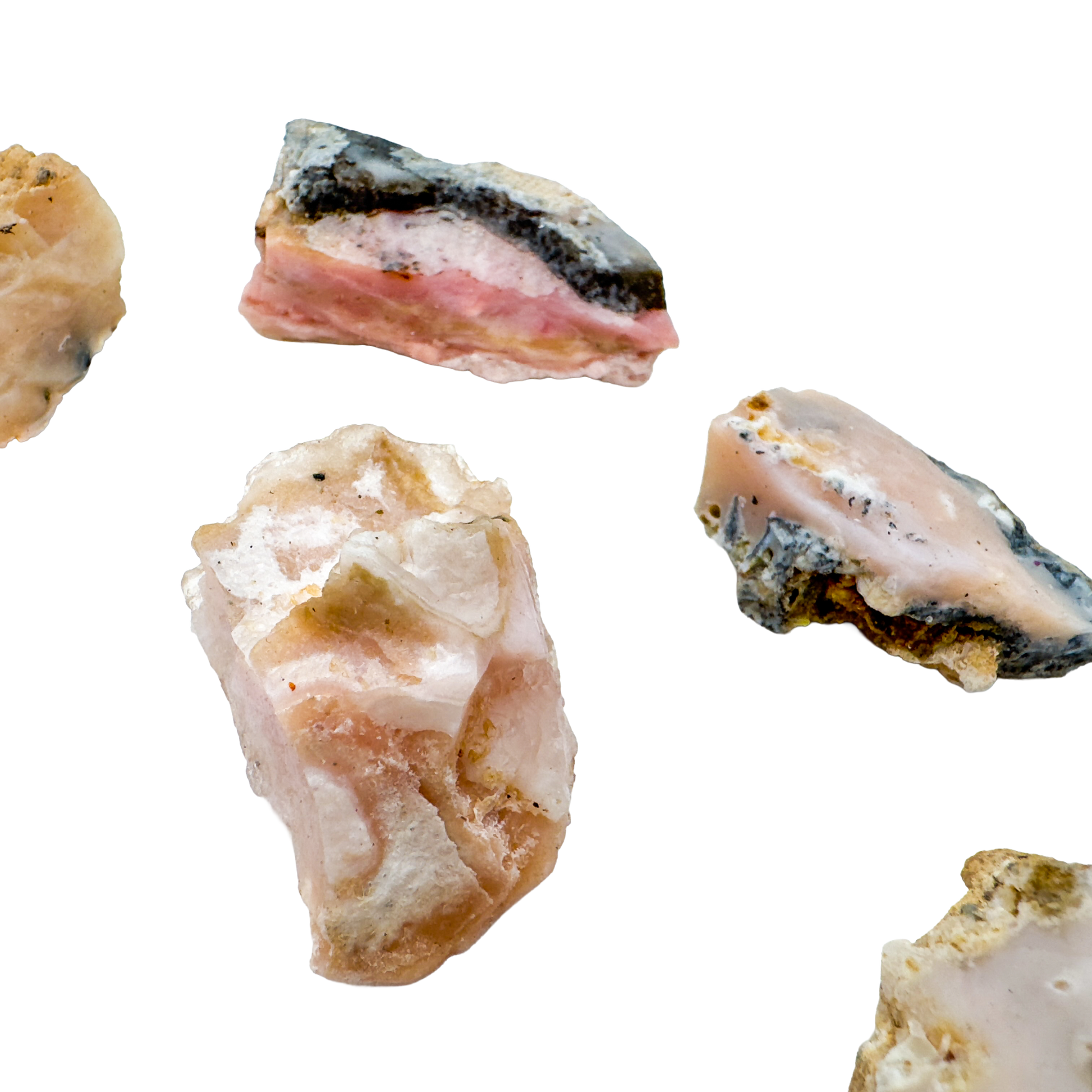 Variety of Pink Opal raw crystals (Grade A, Peru) showing range of pink tones for self love and heart-centered work