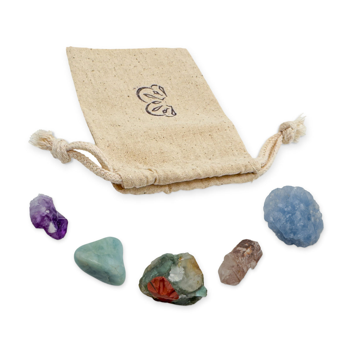 Pisces Crystal Kit: amethyst point, aquamarine, bloodstone, lithium quartz point and blue calcite, arranged with the reusable cotton bag they come in, on white