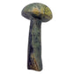 Top-down view of the serpentine mushroom cap, mottled green surface polished smooth by hand.