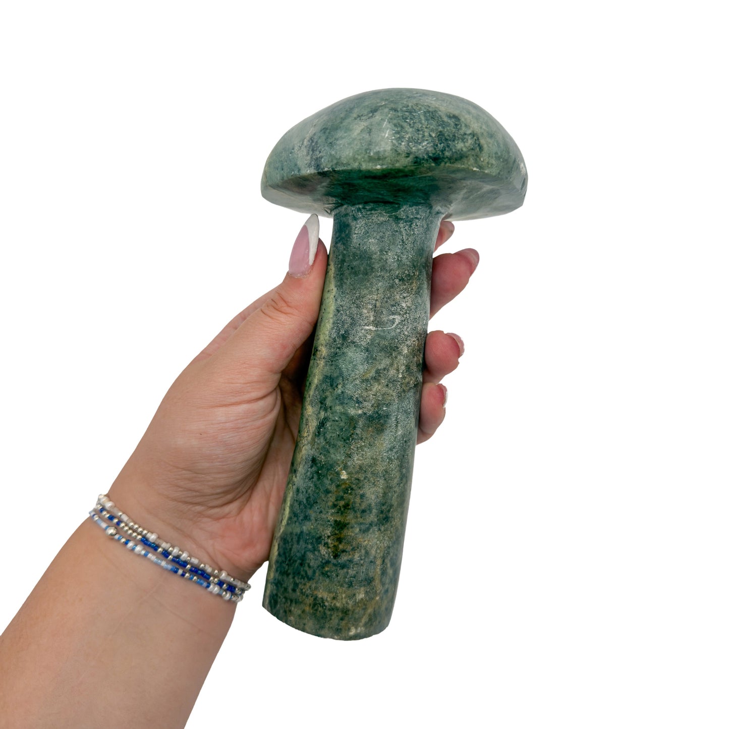 Serpentine mushroom no. 1 held in an open hand, showing the true scale of this 7.04 inch, 2.30 pound carving.