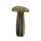 Right profile of a hand-carved agate mushroom, undyed gray chalcedony with natural layering.