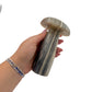Agate mushroom no. 2 held in an open hand, showing the true scale of this 5.66 inch, 1.51 pound carving.