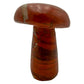 Angled view of a 1.70 pound red jasper mushroom carving, darker iron seams crossing the polished surface.