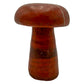 Left profile of red jasper mushroom no. 3, wide 3.32 inch cap sitting low over a short stem.