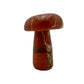 Right profile of a hand-carved red jasper mushroom, opaque iron-rich chalcedony, undyed.