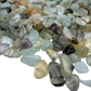 Prehnite polished chips in hand showing size reference, pale green Namibia material