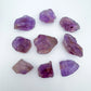 Grain detail of Grade AA Ametrine raw stone, sourced from Ángel Sandoval Province, Bolivia, showing natural variation.