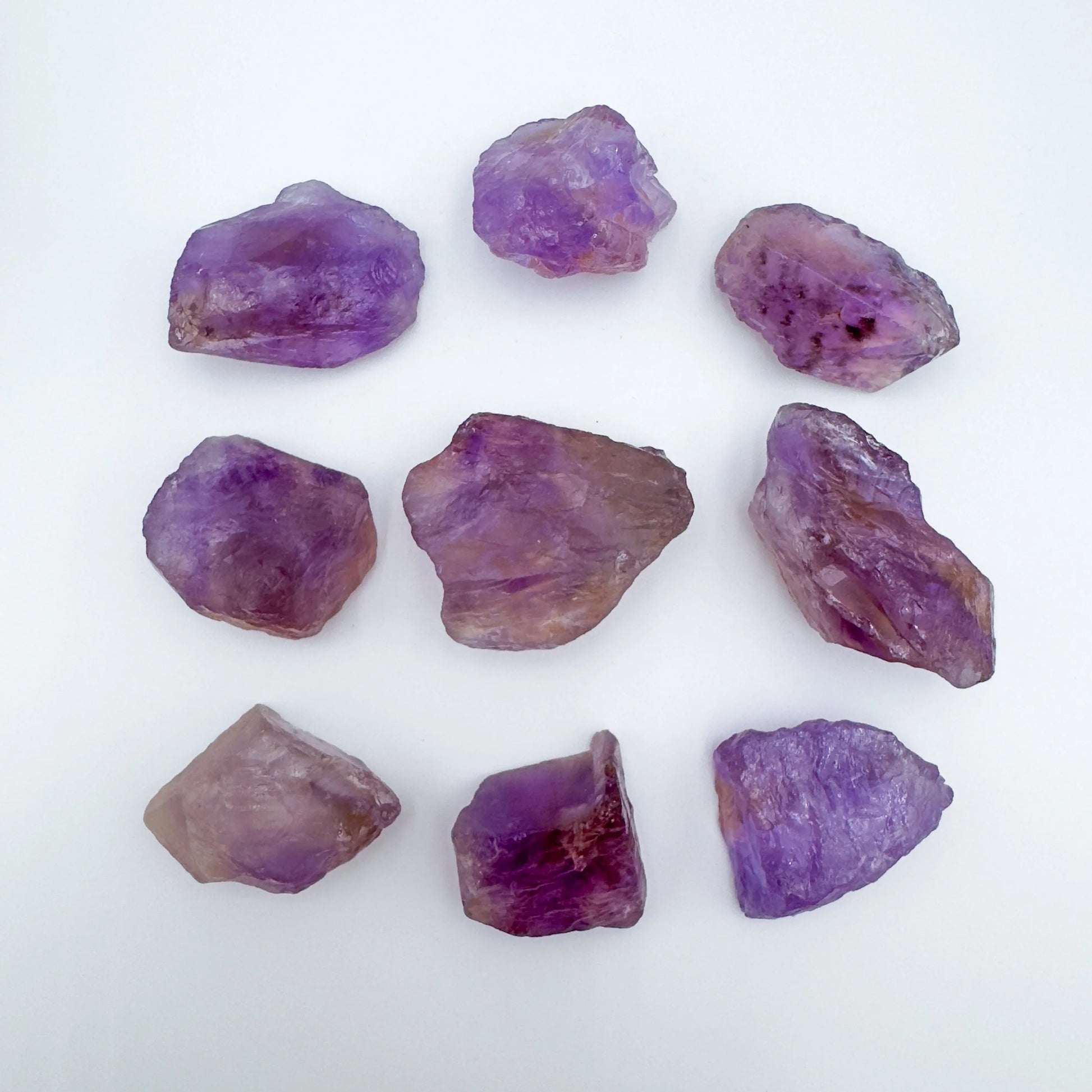 Grain detail of Grade AA Ametrine raw stone, sourced from Ángel Sandoval Province, Bolivia, showing natural variation.