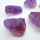 Grade aa ametrine raw held in hand for size reference