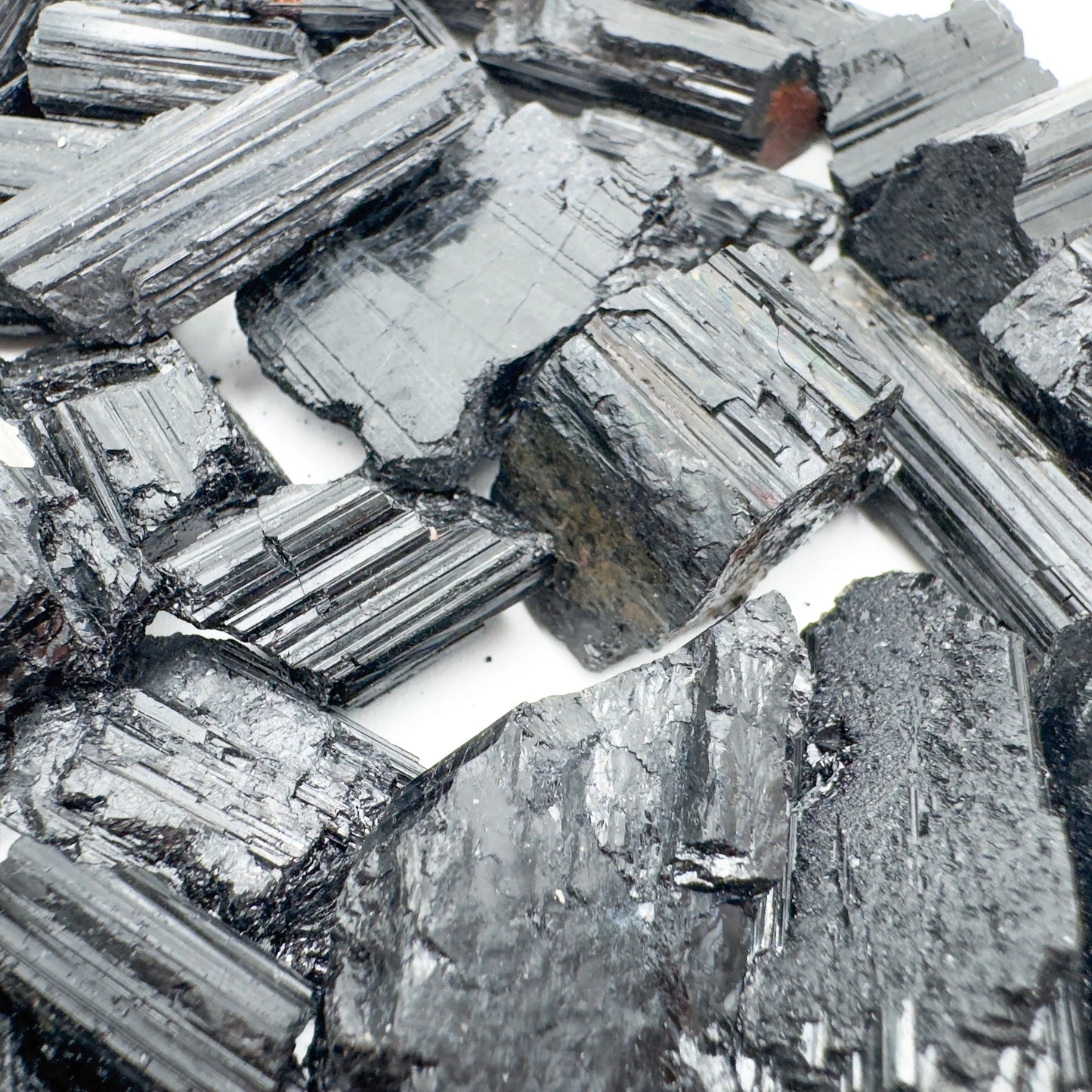 Alternate angle of Grade AA Black Tourmaline raw showing overall shape