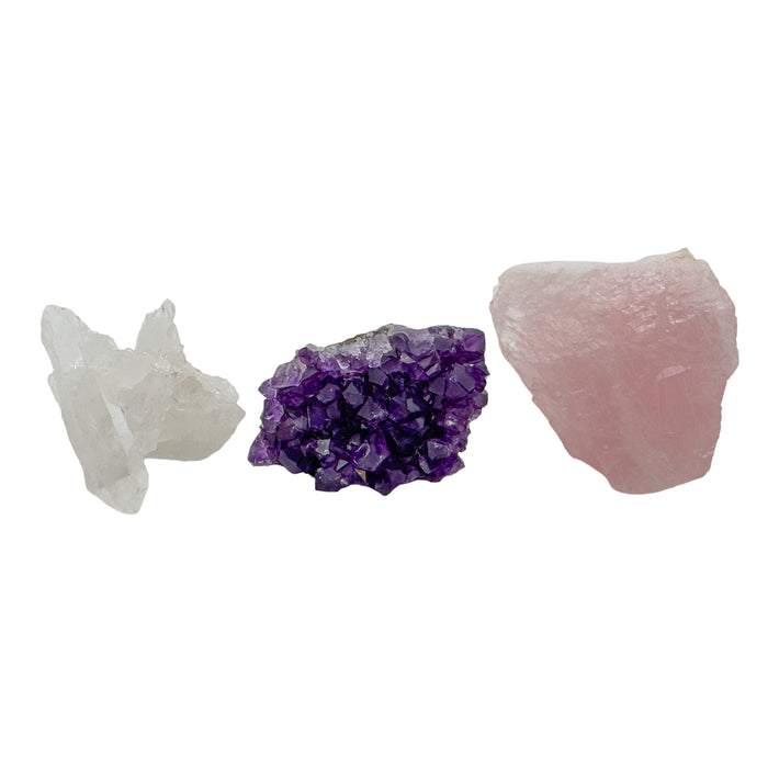 Raw crystal set trio with amethyst cluster, clear quartz cluster and rose quartz on white