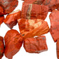 Profile view of Grade AA Red Jasper raw stone, showing natural variation.