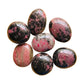 Rhodonite Palm Stones traditionally associated with Emotional Healing, Grounding & Love — black polished, AA grade from Madagascar