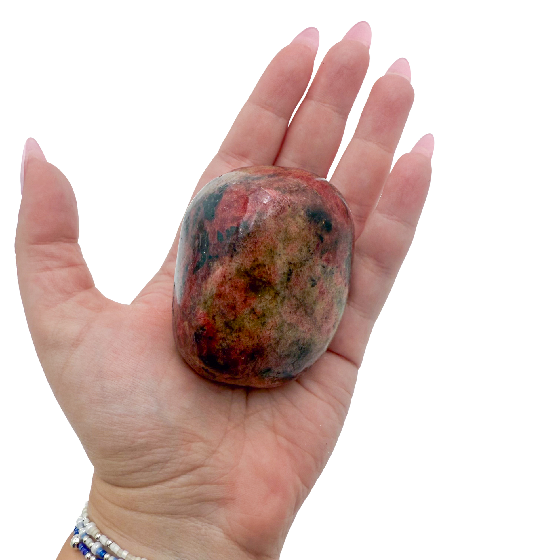 Rhodonite polished free form from Zimbabwe held in hand to show scale
