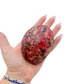 Rhodonite polished free form from Zimbabwe held in hand to show scale