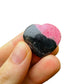 Edge-on view of Rhodonite polished heart, showing translucent edges, hand-selected from Atsimo-Andrefana, Madagascar.