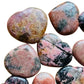 Back view of Rhodonite polished heart, showing natural sheen.